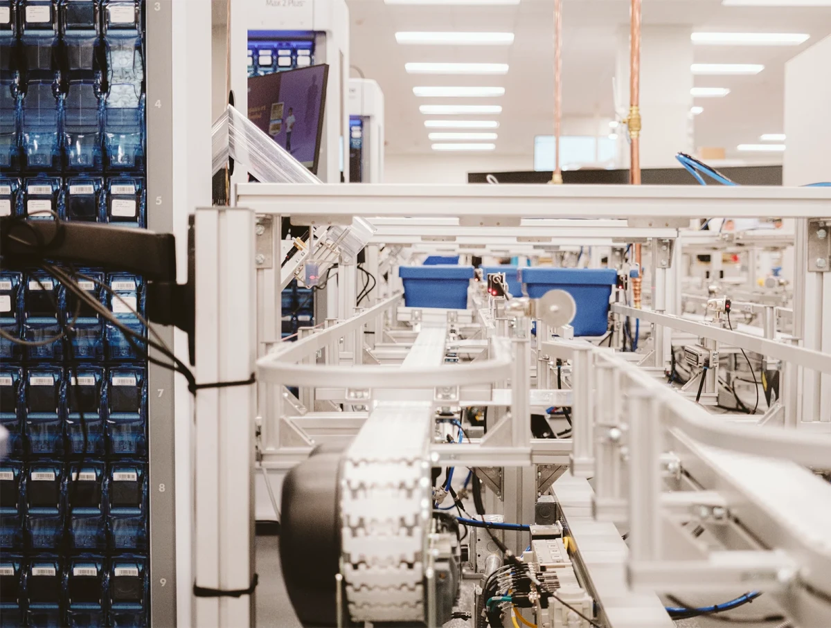 automated pharmaceutical equipment on a conveyer belt