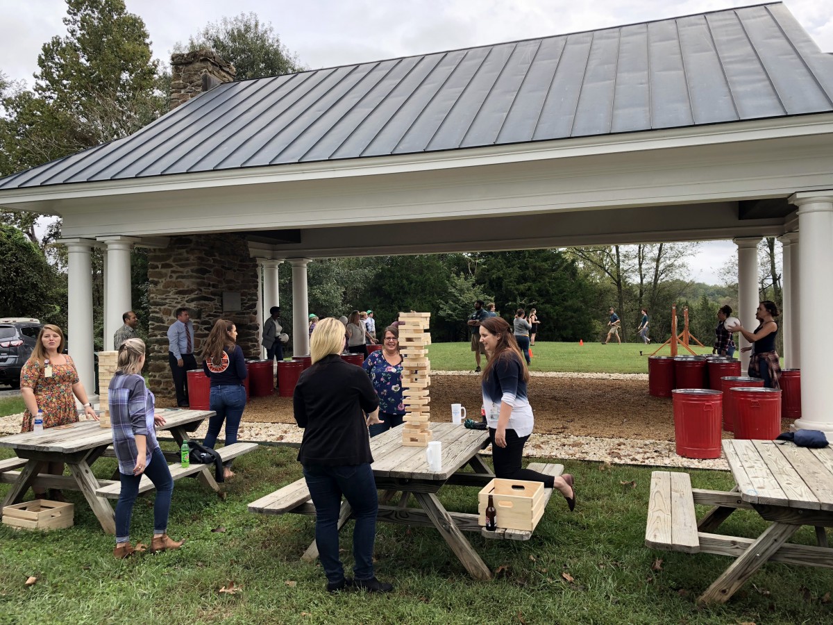 People play yard games on a fall afternoon