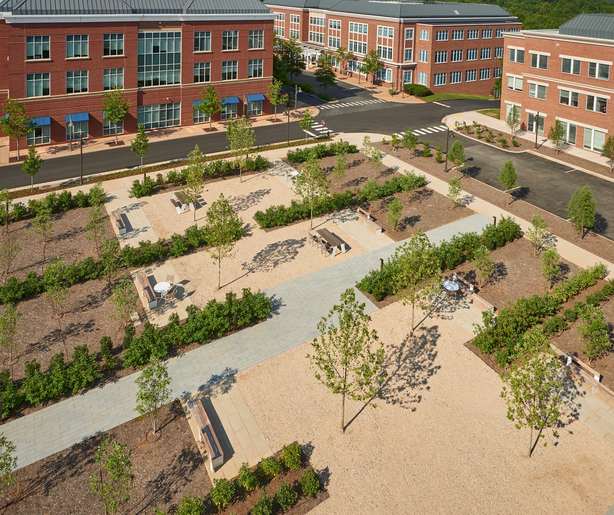 Aerial view of outdoor plaza with picnic tables and landscaping